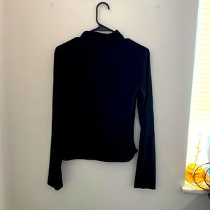 Black turtle neck with zipper in the back
